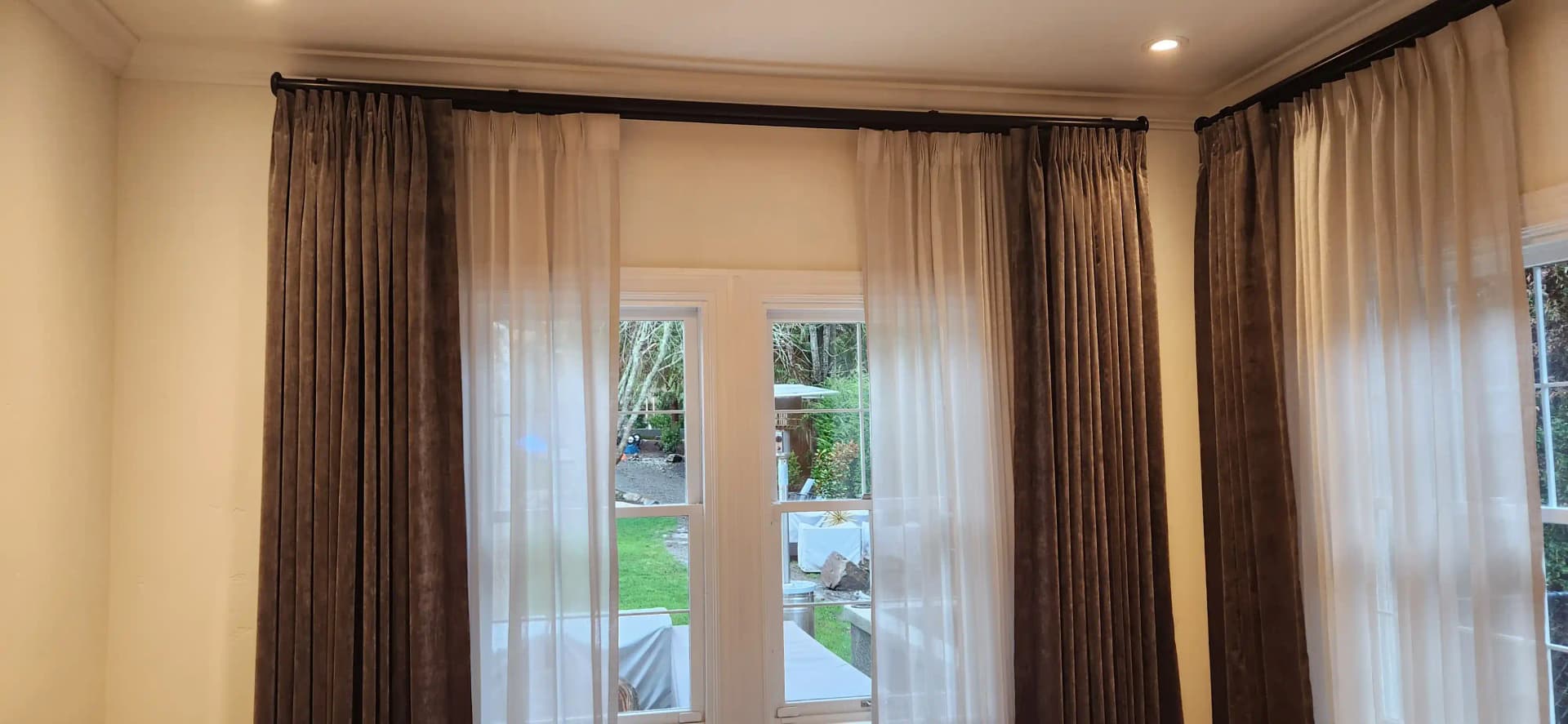 Custom drapery installation in a finished home interior
